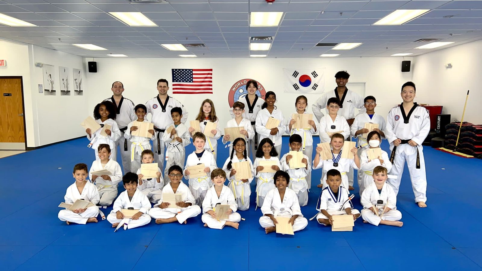 Students and instructors of World Class Tae Kwon Do gathered on the mat