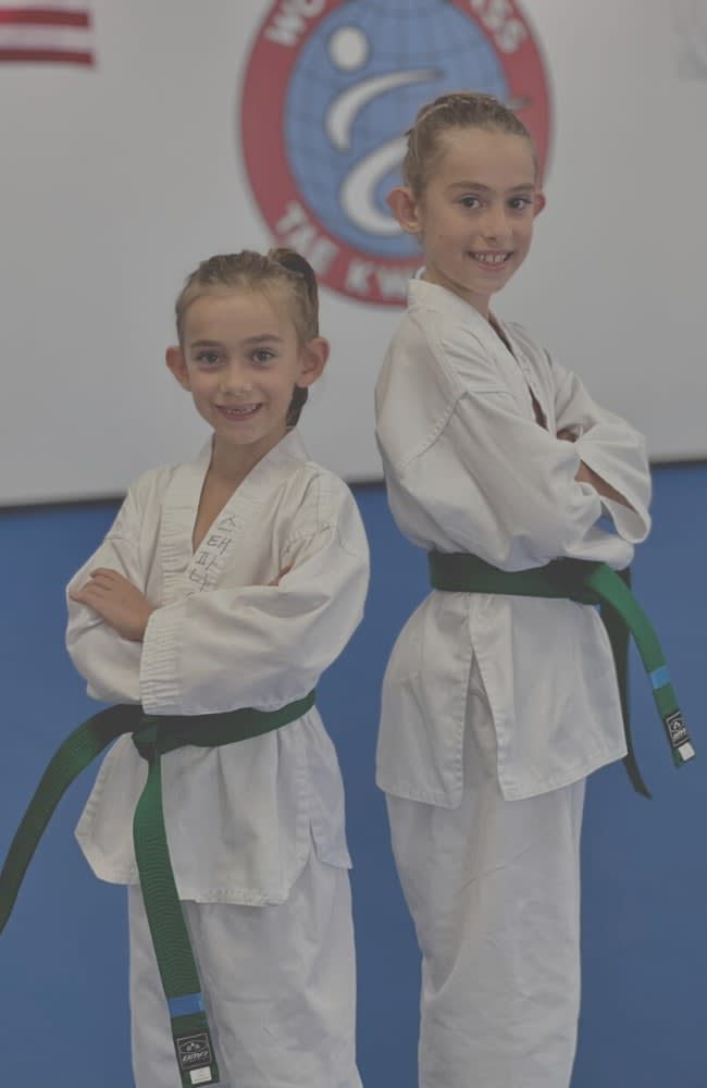 Two young students in uniform at World Class Tae Kwon Do